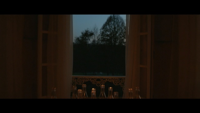 Video Reference: Black, Darkness, Photograph, Light, Lighting, Sky, Property, Architecture, Wall, Window, Person, Front, Sitting, Man, Small, Large, White, Dark, Standing, Holding, Table, Room, Woman, Sign, Phone, Street