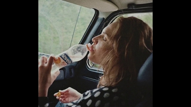 Video Reference: Alcohol, Mouth, Blond, Human, Drink, Photography, Selfie, Photo caption, Long hair, Car seat