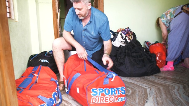 Video Reference: man, old man, bag, woman, sport bag, home, door, woman, people