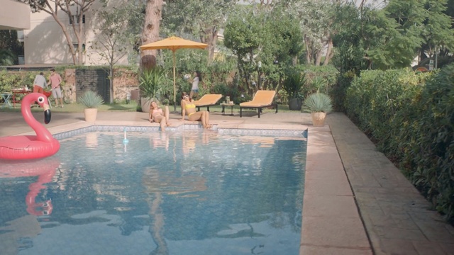 Video Reference: swimming pool, leisure, property, resort, backyard, estate, water, outdoor structure, water feature, real estate