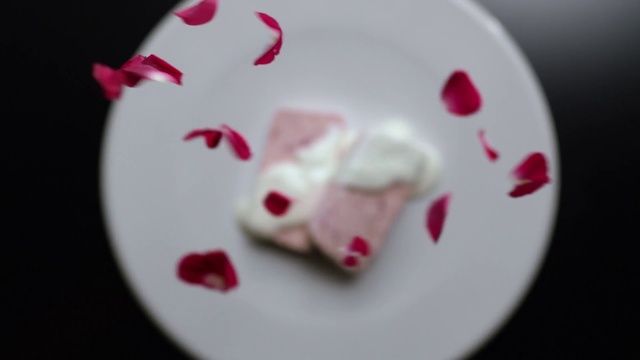 Video Reference: Pink, Heart, Hand, Food, Valentine day, Finger, Cuisine, Nail, Indoor, Plate, White, Cake, Small, Sitting, Table, Looking, Toy, Close, Red, Black, Holding, Birthday, Cup, Laying, Bird, Remote, Bear, Clock, Video, Birthday cake, Valentines day, Carmine, Candy, Cartoon