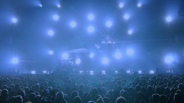 Video Reference: Performance, Entertainment, Blue, Rock concert, Concert, Sky, Performing arts, Event, Stage, Crowd