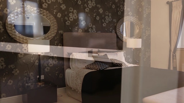 Video Reference: room, interior design, wall, furniture, floor, flooring, living room, Person