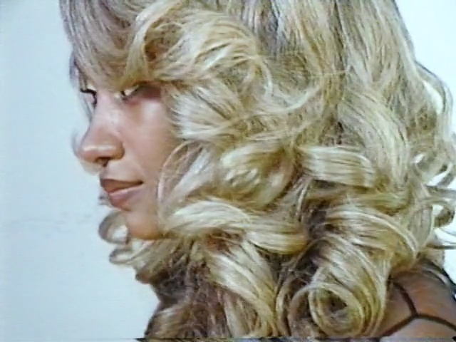 Video Reference: hair, blond, human hair color, hairstyle, layered hair, chin, long hair, hair coloring, ringlet, brown hair