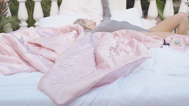 Video Reference: pink, textile, bedding, bed sheet, linens, leg, bed, girl, material, pillow, Person