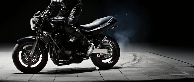 Video Reference: motorcycle, land vehicle, vehicle, motor vehicle, car, automotive lighting, black and white, automotive design, wheel, rim