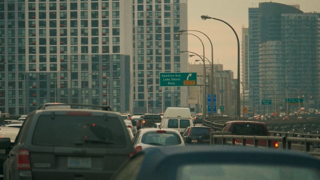 Video Reference: metropolitan area, urban area, car, road, city, metropolis, skyscraper, lane, infrastructure, downtown