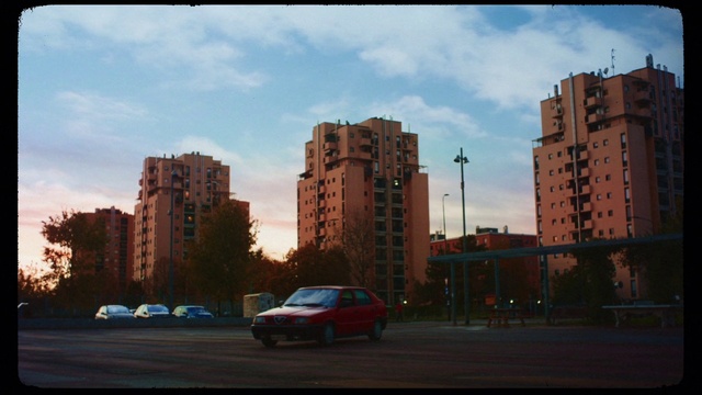 Video Reference: Urban area, Sky, City, Mode of transport, Human settlement, Landmark, Vehicle, Town, Car, Metropolitan area