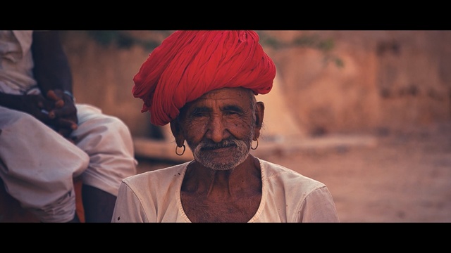 Video Reference: Turban, People, Dastar, Moustache, Human, Forehead, Facial hair, Headgear, Adaptation, Eye, Person