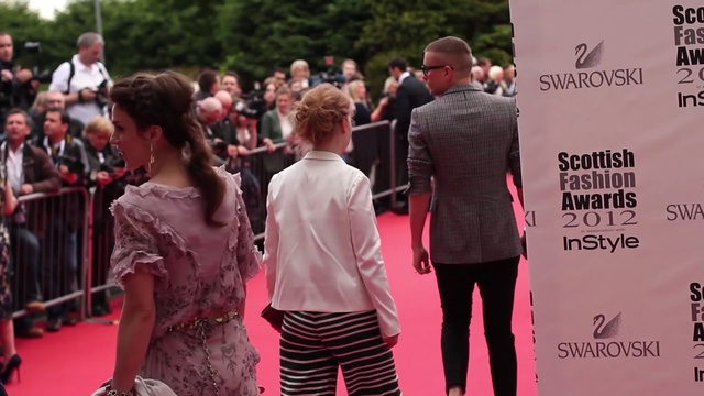 Video Reference: fashion, flooring, carpet, red carpet, event, girl, product, crowd, fashion design, Person