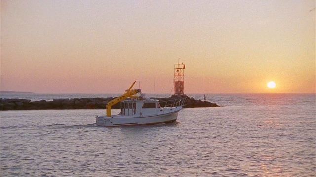Video Reference: water transportation, waterway, sea, calm, ship, boat, watercraft, sky, ocean, sunset, Person