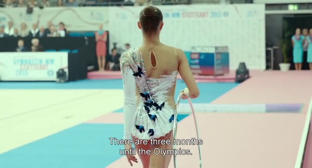 Video Reference: Shoulder, Snapshot, Performing arts, Dress, Gymnastics, Fashion, Rhythmic gymnastics, Joint, Leg, Individual sports