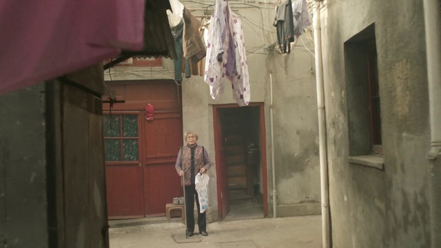 Video Reference: Alley, Snapshot, Neighbourhood, Street, Infrastructure, Outerwear, Textile, Road, Building, Facade