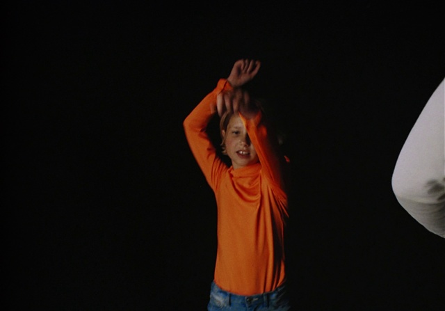 Video Reference: Orange, Arm, Performance, Human body, Performance art, Hand, Performing arts, Photography, Talent show, Dance