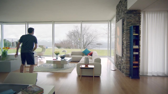 Video Reference: room, interior design, window, furniture, floor, house, table, apartment, flooring, window covering, Person