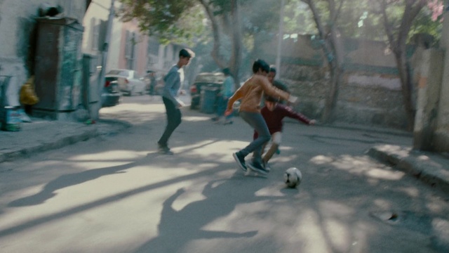 Video Reference: Street football, Snapshot, Fun, Footwear, Tree, Screenshot, Pedestrian, Photography, Recreation, Leisure