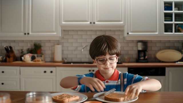 Video Reference: room, child, eating, kitchen, toddler, meal, cook, interior design, food, cuisine, Person