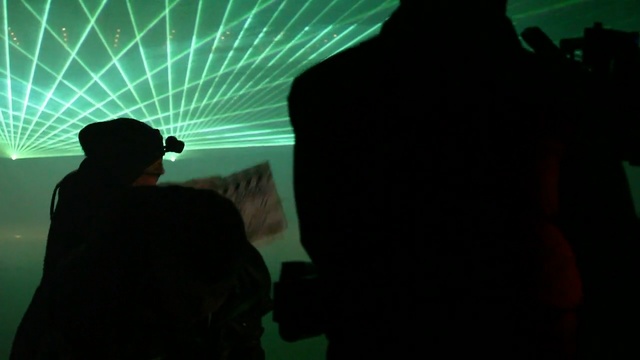 Video Reference: green, black, darkness, light, snapshot, night, fun, lighting, sky, silhouette, Person