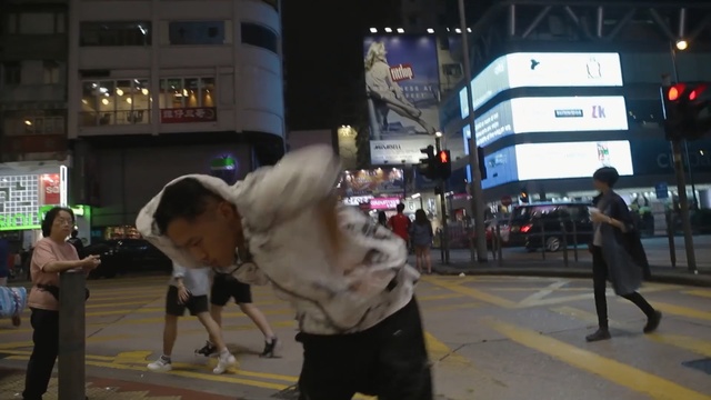 Video Reference: pedestrian, infrastructure, street, road, event, crowd, night, city, recreation, pedestrian crossing