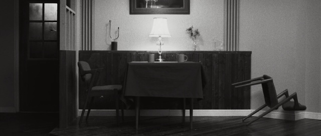 Video Reference: black, furniture, black and white, table, room, chair, interior design, monochrome photography, wall, floor