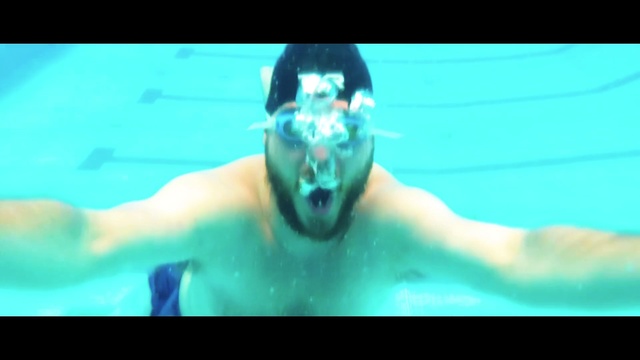 Video Reference: Underwater, Swimmer, Recreation, Swimming, Swimming pool, Fun, Chest, Individual sports, Leisure, Freediving, Water, Sport, Monitor, Screen, Photo, Looking, Large, Television, Man, Blue, Polar, Bear, Cat, Pool, Holding, White, Ball, Woman, Playing, Display, Boat, Phone, Game, Standing, Ocean, Human face, Person, Water sport