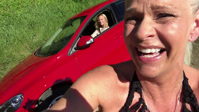 Video Reference: Vehicle, Car, Vehicle door, Photography, Selfie, Smile, Sport utility vehicle, City car, Person, Grass, Outdoor, Smiling, Woman, Wearing, Posing, Camera, Sitting, Red, Man, Glasses, Front, Holding, Young, Close, Black, Driving, Talking, Hot, Dog, Motorcycle, Riding, Baseball, White, Hat, Standing, Phone, Parked, Human face, Land vehicle, Clothing, Wheel