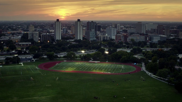 Video Reference: Metropolitan area, Cityscape, Urban area, Sky, Sport venue, Skyline, City, Daytime, Human settlement, Aerial photography