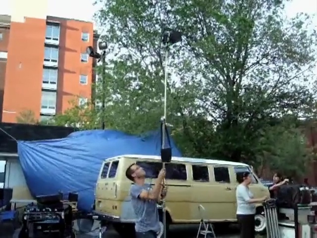 Video Reference: car, transport, vehicle, mode of transport, luxury vehicle, van, automotive exterior, tree, public transport, family car, Person