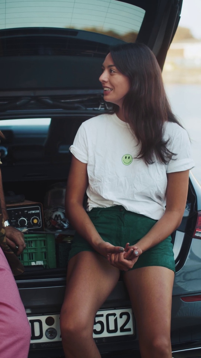 Video Reference: Thigh, Leg, Human leg, Vehicle, Car, Long hair, Brown hair, Black hair, Shorts, T-shirt