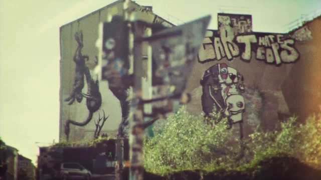 Video Reference: Green, Wall, Art, Street art, Graffiti, Tree, Font, Visual arts, Mural, Architecture, Cake, Train, Covered, Decorated, Birthday, Sign, Old, Truck, Table, Man, Fire, Street, Standing, Riding, People, Text