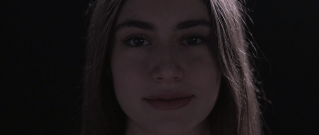 Video Reference: Face, Hair, Lip, Eyebrow, Nose, Black, Cheek, Photograph, Facial expression, Chin