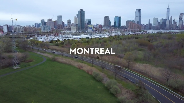 Video Reference: metropolitan area, city, urban area, skyline, suburb, road, residential area, transport, track, bird's eye view, Person