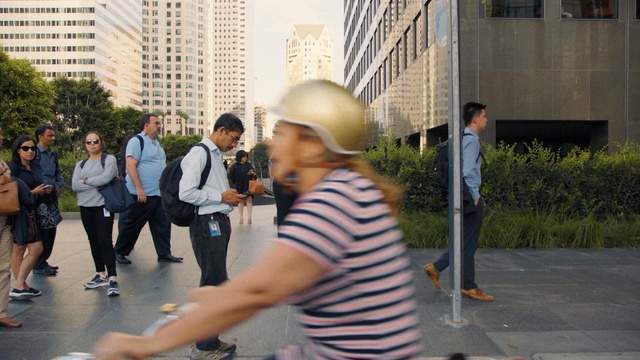 Video Reference: road, infrastructure, urban area, public space, street, snapshot, city, recreation, pedestrian, tree, Person