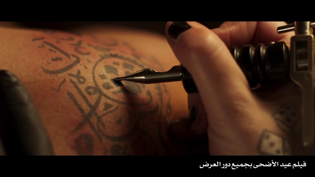 Video Reference: Tattoo, Arm, Hand, Finger, Wrist, Muscle, Flesh, Font, Ink, Calligraphy, Indoor, Person, Sitting, Front, Black, Holding, Laying, Using, Close, Woman, Someone, Table, Man, Cat, Nail, Pen