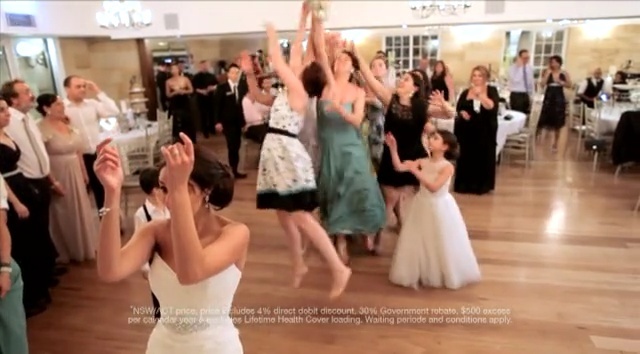 Video Reference: Gown, Photograph, Dress, Event, Facial expression, Wedding dress, Function hall, Ceremony, Wedding reception, Bridal clothing