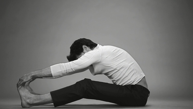 Video Reference: White, Shoulder, Physical fitness, Arm, Black-and-white, Joint, Yoga, Leg, Stretching, Pilates, Person, Man, Air, Jumping, Young, Racket, Holding, Doing, Game, Ball, Leaning, Shirt, Woman, Board, Player, Standing, Trick, Water, Black, Playing, Court, Bed, Swinging, Riding, Room, Ramp, Flying, Kiss, Elbow, Dance