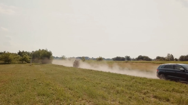 Video Reference: Atmospheric phenomenon, Natural environment, Dirt road, Vehicle, Land lot, Plain, Ecoregion, Dust, Pasture, Rural area