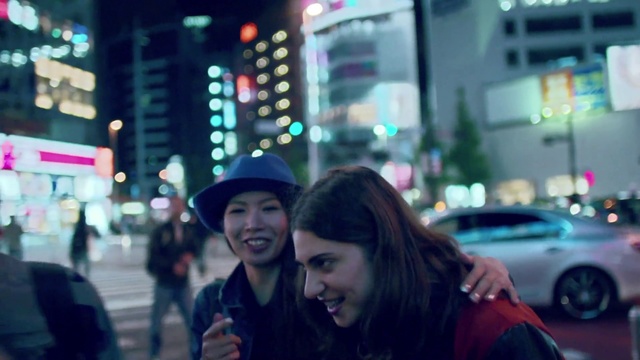 Video Reference: Photograph, Face, People, Snapshot, Street, Urban area, Pedestrian, City, Metropolitan area, Night