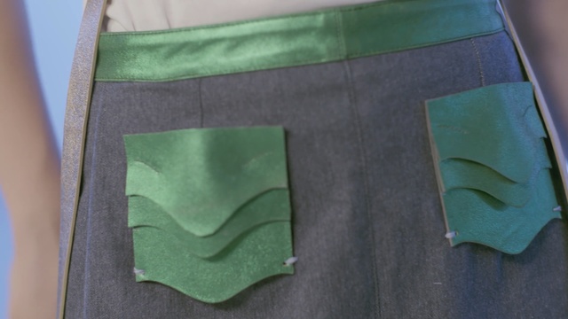 Video Reference: green, pocket, material, pattern, shorts