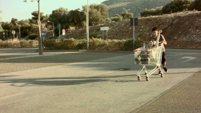 Video Reference: Product, Mode of transport, Asphalt, Road, Vehicle, Walking, Shadow, Street, Recreation, Cart