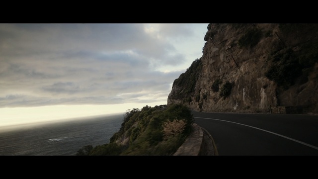 Video Reference: Sky, Nature, Photograph, Cliff, Rock, Road, Horizon, Terrain, Coast, Cloud