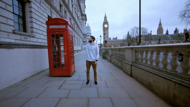 Video Reference: Red, Landmark, Standing, Building, Pedestrian, Architecture, Tourism, Photography, City, Vacation, Person