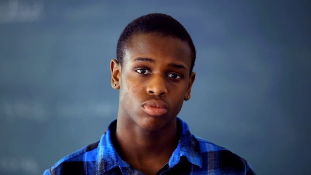 Video Reference: Face, Blue, Forehead, Cheek, Chin, Hairstyle, Human, Buzz cut, Smile, Black hair