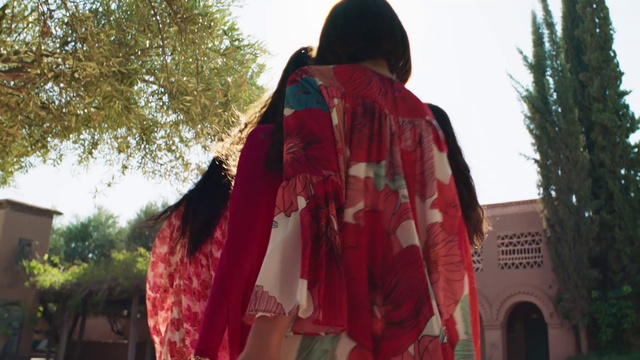 Video Reference: Clothing, Red, Outerwear, Maroon, Textile, Costume, Temple, Jacket, Fashion accessory, Shawl
