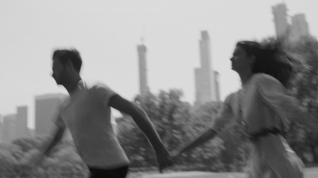 Video Reference: Black, Photograph, White, Black-and-white, Monochrome photography, Monochrome, Snapshot, Standing, Photography, Fun, Person, Man, Woman, Holding, Photo, Young, Riding, Playing, Blurry, Street, Black and white, Fog, Sky, Clothing, Human face, Crowd