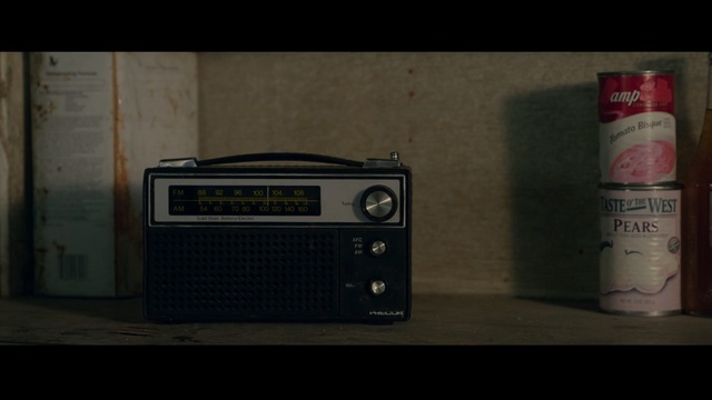 Video Reference: technology, electronic device, radio, electronics, electronic instrument, guitar amplifier, font, product, stereophonic sound, Person