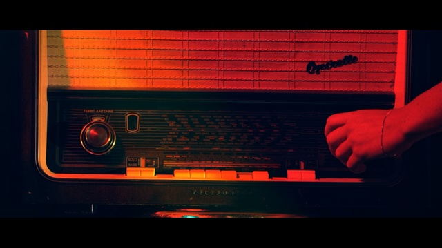 Video Reference: red, light, darkness, line, night, font, musical instrument accessory, screenshot, computer wallpaper, display device