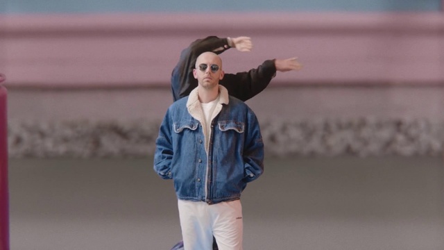 Video Reference: Blue, Denim, Jeans, Street fashion, Beauty, Fashion, Textile, Outerwear, Jacket, Fun, Person, Building, Sport, Outdoor, Game, Throwing, Ball, Baseball, Young, Standing, Woman, Player, Wearing, Holding, Field, Little, Walking, Glove, Black, Girl, Red, Boy, Court, Playing, Pitcher, Hat, Pitch, Water, Man, Air, White, Frisbee, Shirt, Trousers, Clothing, Athletic game, Coat, Sleeve, Collar, Human face, Tennis, Top, Glasses, Pocket