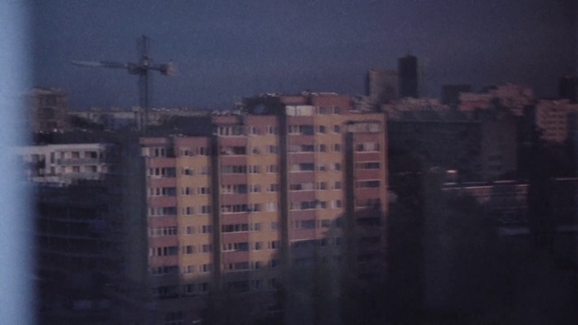 Video Reference: Sky, Cloud, Atmospheric phenomenon, Urban area, Water, City, Night, Human settlement, Morning, Metropolitan area