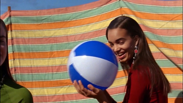 Video Reference: facial expression, ball, fun, leisure, smile, girl, play, recreation, world, ball, Person